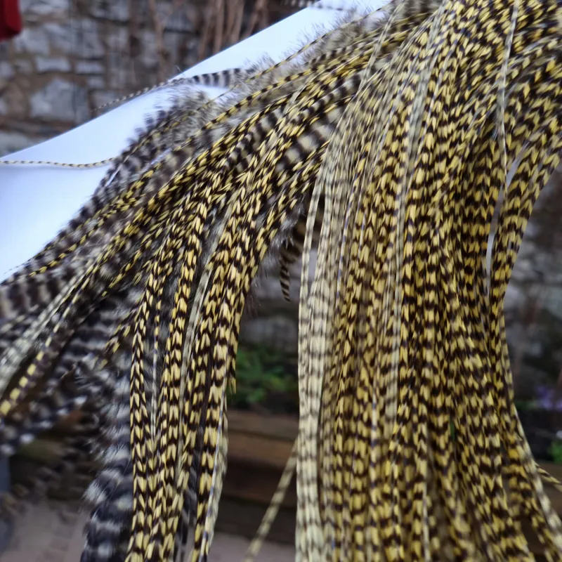 Whiting 1/2 Bronze Grade Dry Fly Rooster Saddle in Grizzly Pale Yellow-2